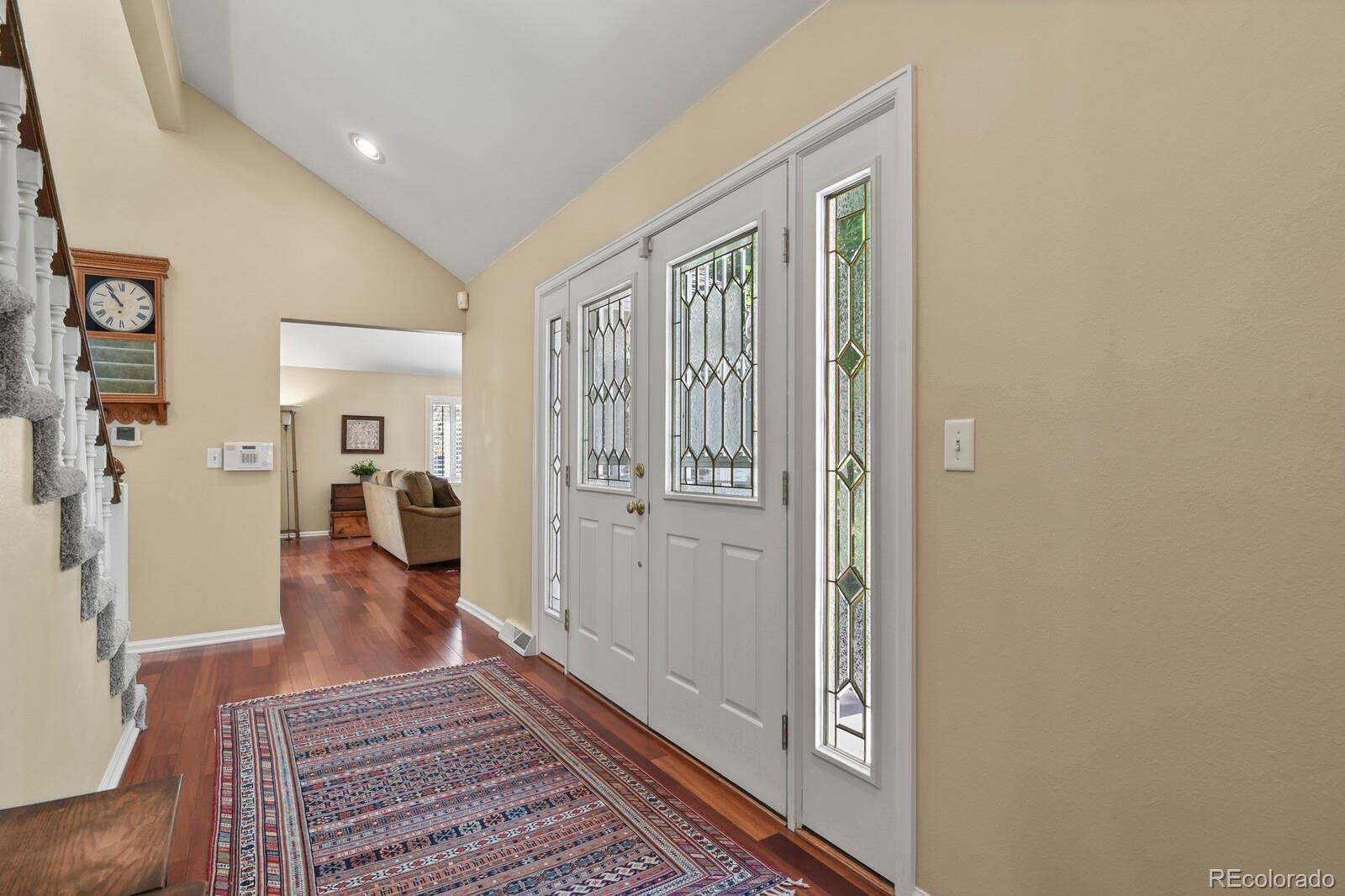 4530 South Verbena Street, Unit 309 Denver, CO 80237 - Photo 10 of 45 a view of a hallway with wooden floor and furniture