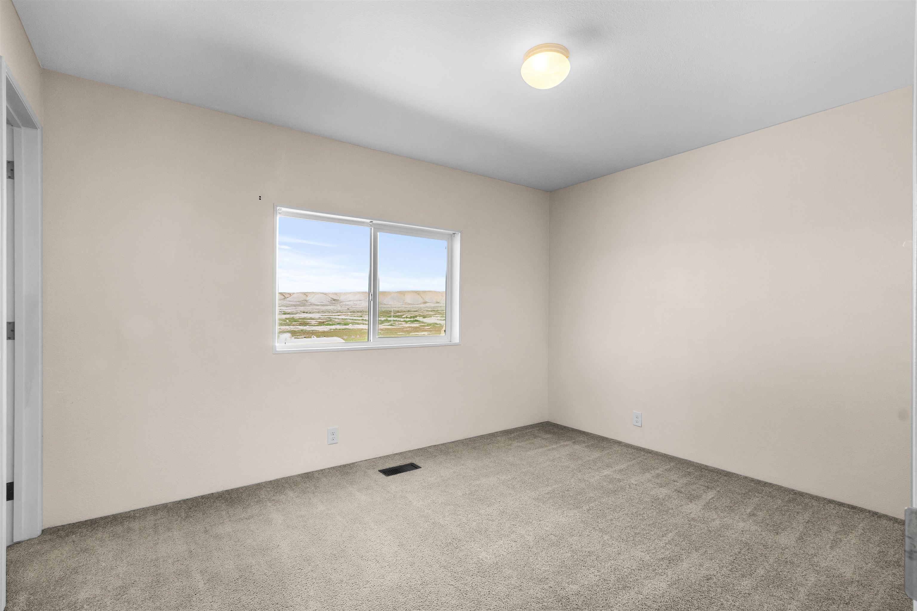 759 33 Road Clifton, CO 81520 - Photo 15 of 35 an empty room with a window