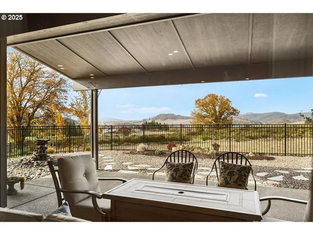 a view of a balcony with chairs and a table