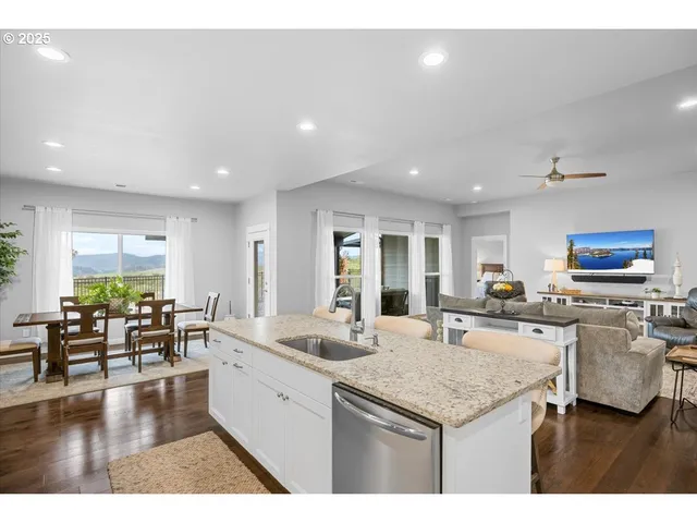 a kitchen with lots of counter top space and living room
