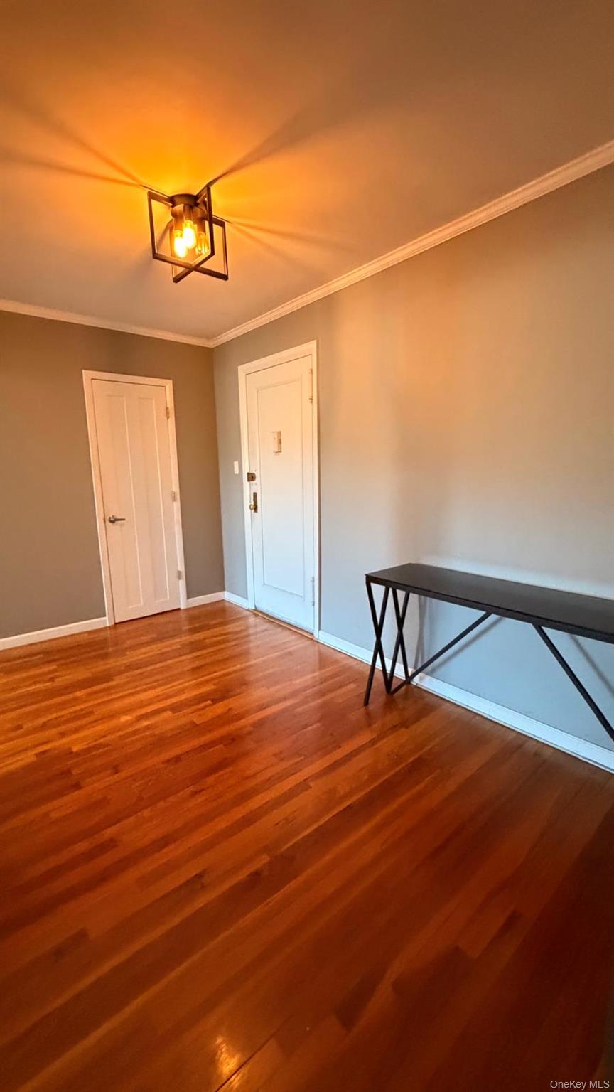 8305 98th Street, Unit 3C Queens, NY 11421 - Photo 3 of 19 a view of a room with wooden floor