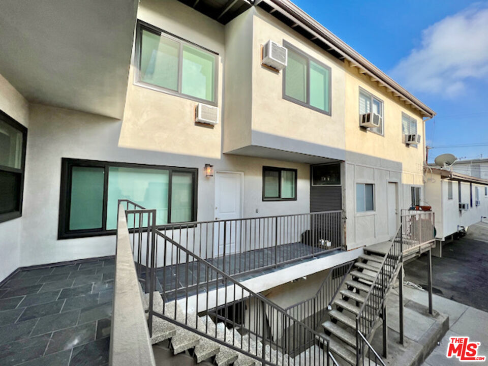 11700 Dorothy Street, Unit 2 Los Angeles, CA 90049 - Photo 26 of 31 a view of a house with backyard and deck