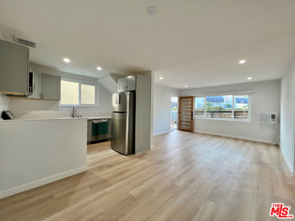 11700 Dorothy Street, Unit 2 Los Angeles, CA 90049 - Photo 9 of 31 a view of a kitchen with a sink and a refrigerator