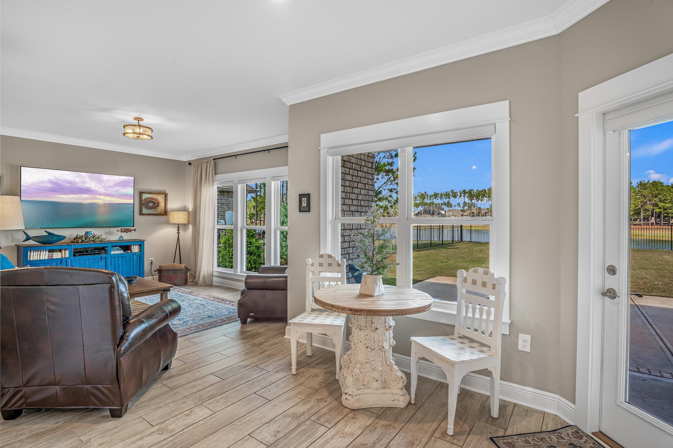 102 Mill Pond Cove Freeport, FL 32439 - Photo 16 of 46 a living room with furniture and a flat screen tv