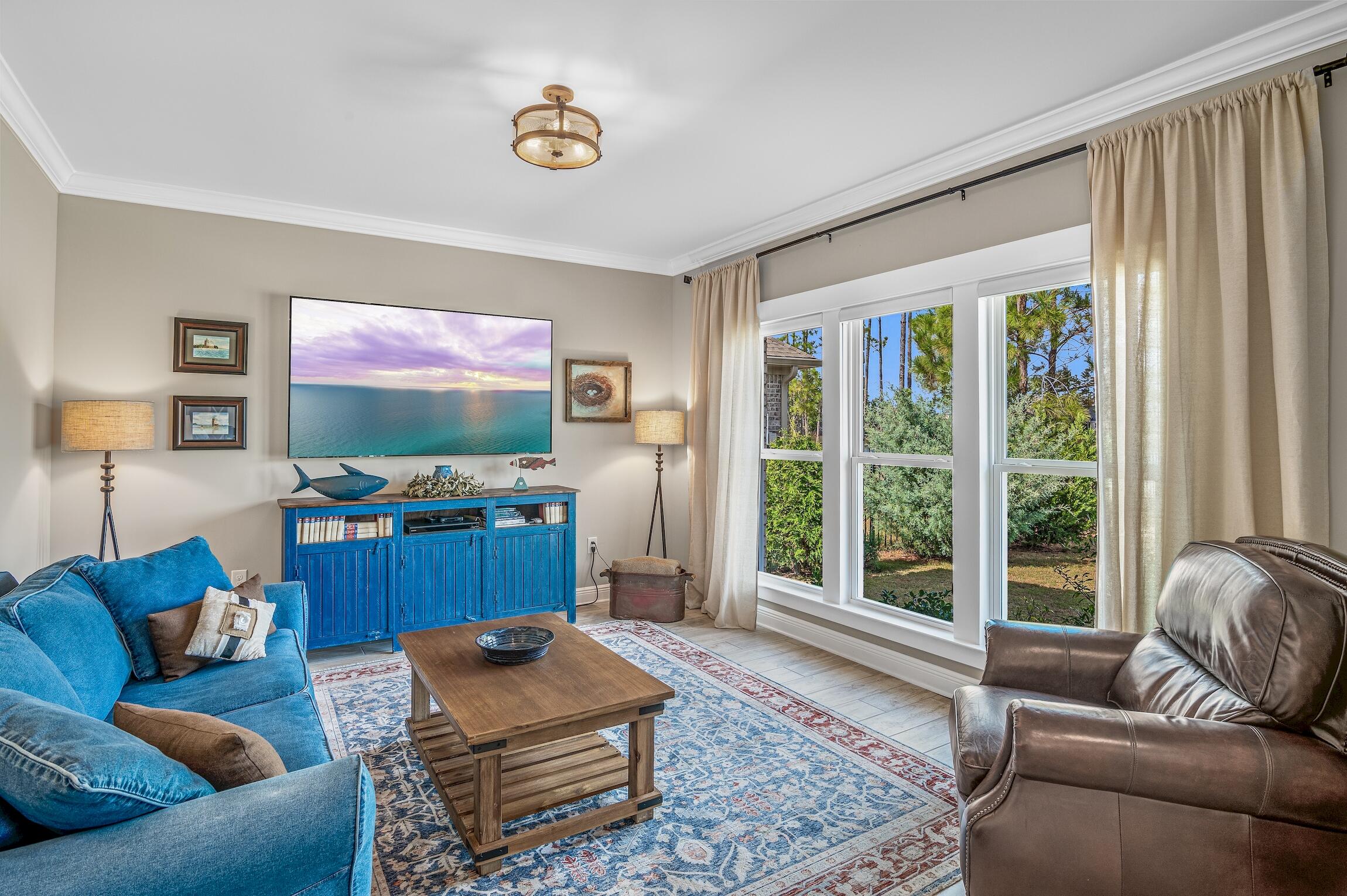 102 Mill Pond Cove Freeport, FL 32439 - Photo 17 of 46 a living room with furniture and a flat screen tv