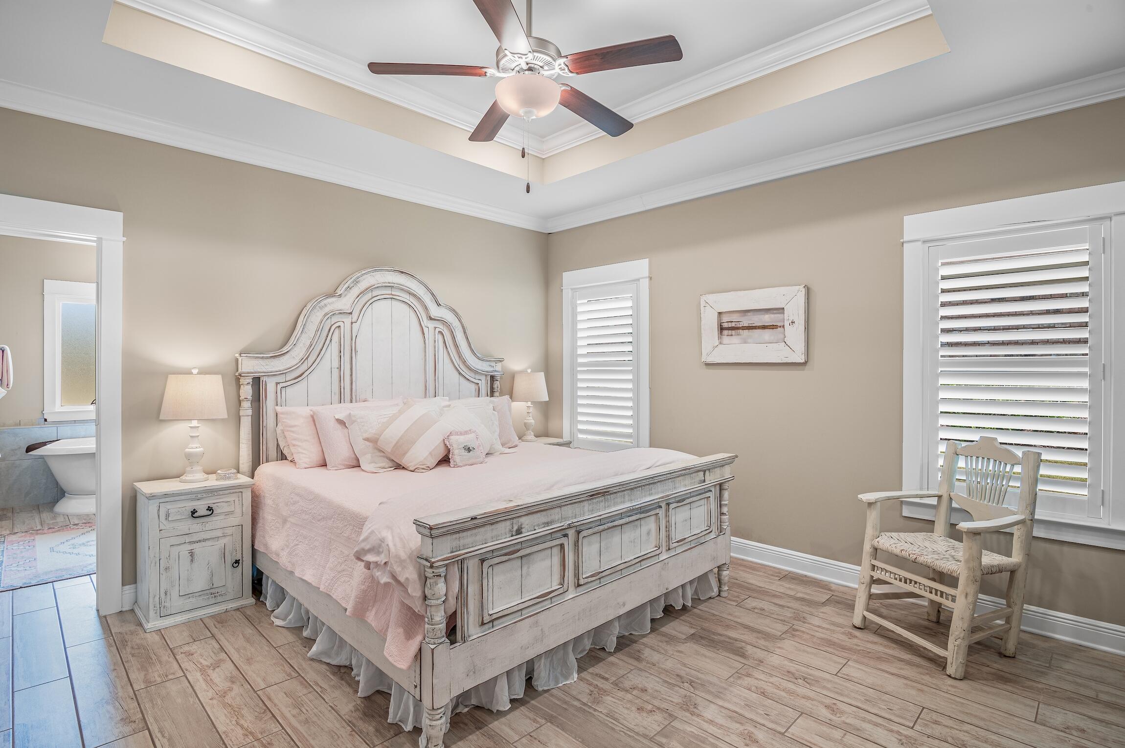 102 Mill Pond Cove Freeport, FL 32439 - Photo 19 of 46 a bedroom with a bed wooden floor and a window