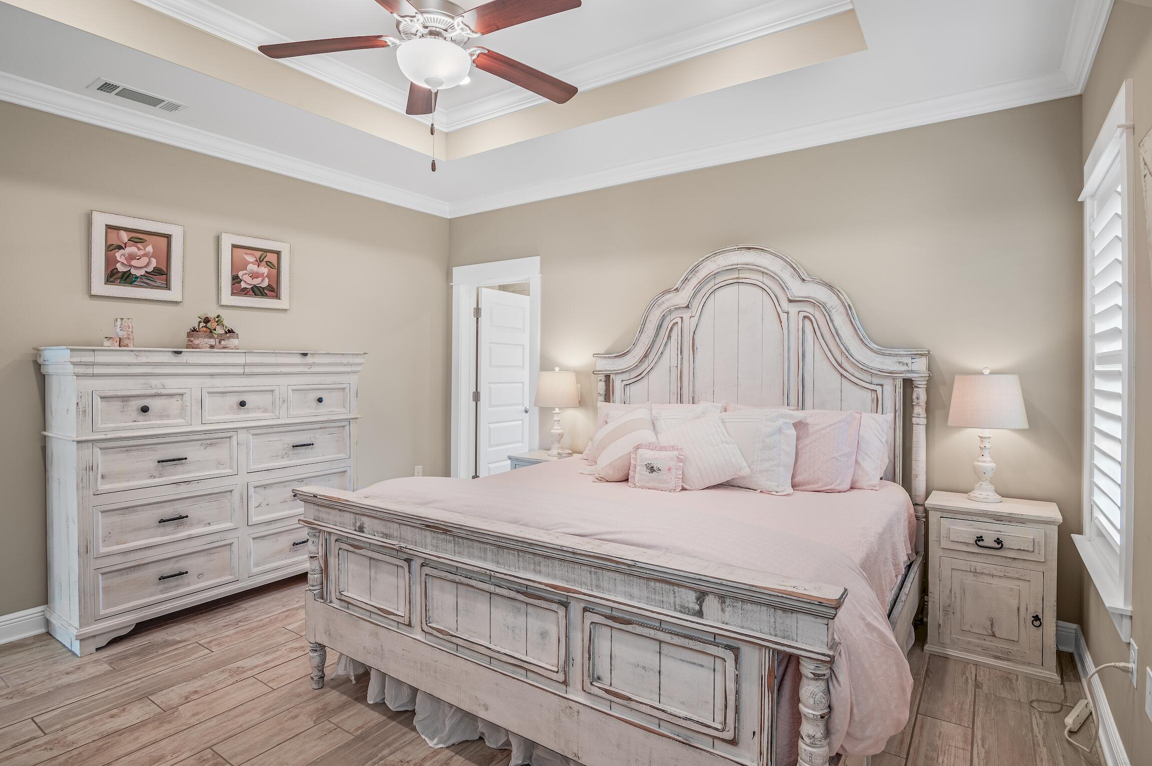 102 Mill Pond Cove Freeport, FL 32439 - Photo 20 of 46 a bedroom with a bed and a dresser