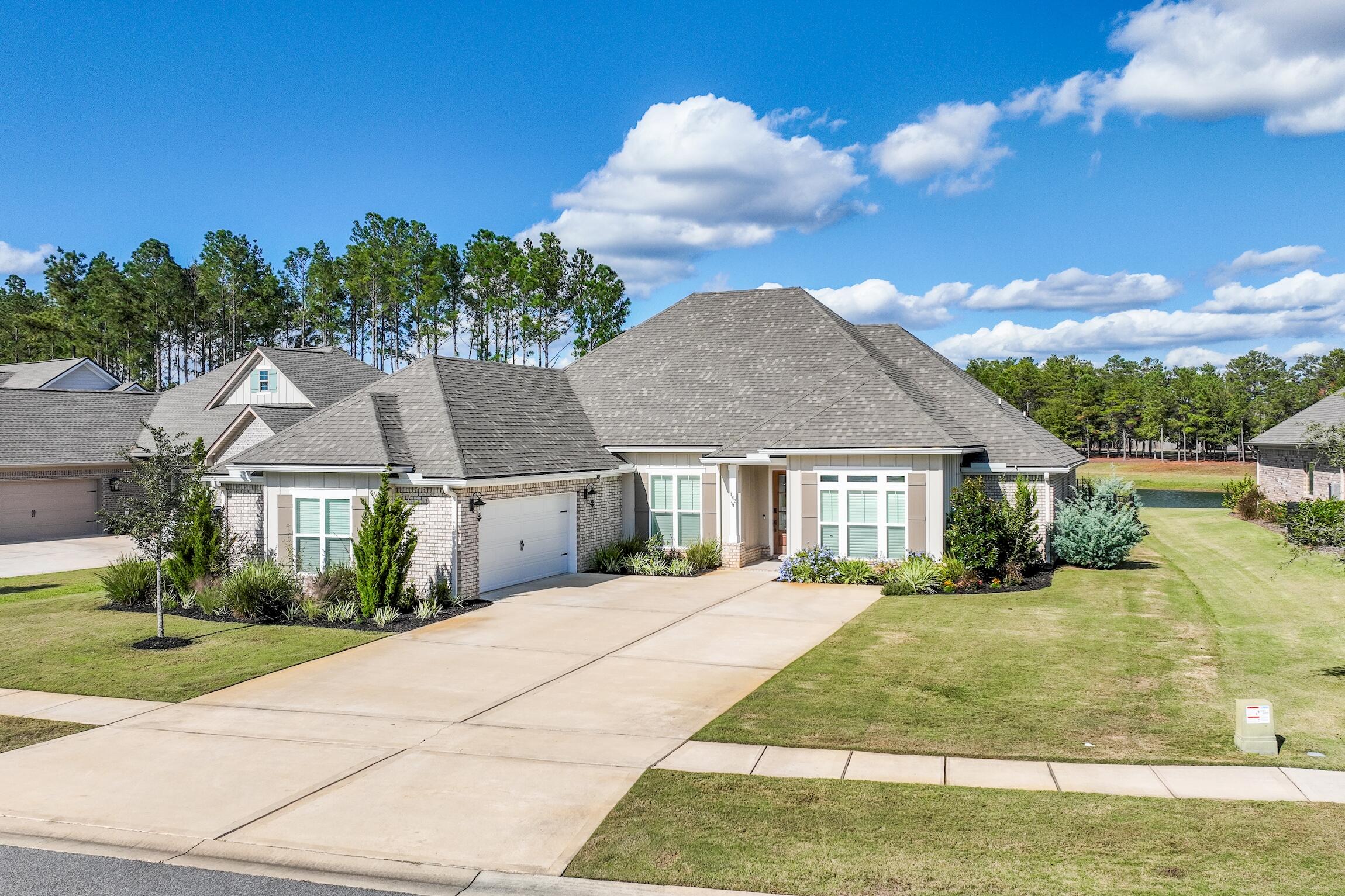 102 Mill Pond Cove Freeport, FL 32439 - Photo 2 of 46 front view of a house with a yard