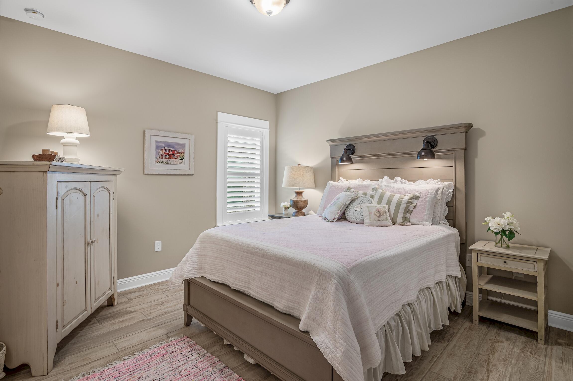 102 Mill Pond Cove Freeport, FL 32439 - Photo 23 of 46 a bedroom with a bed and a window