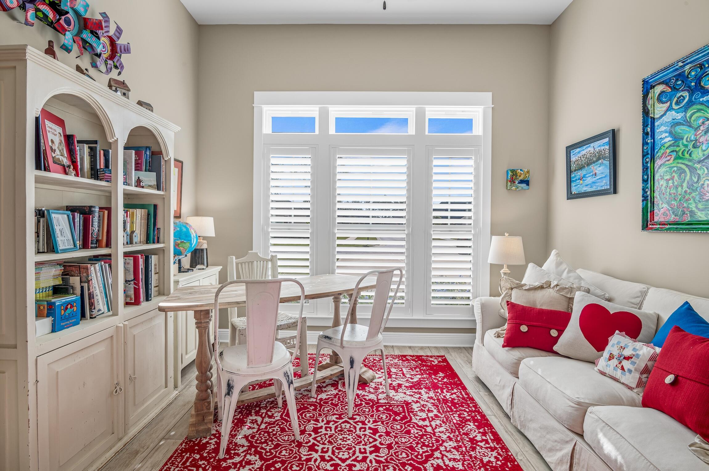 102 Mill Pond Cove Freeport, FL 32439 - Photo 27 of 46 a living room with furniture and a book shelf