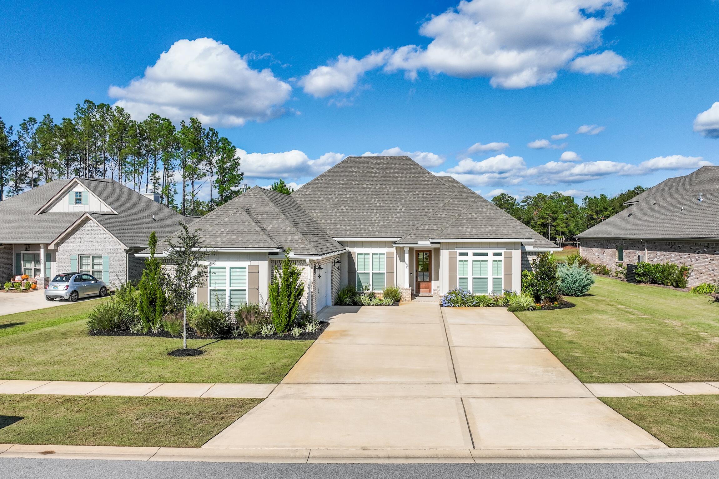 102 Mill Pond Cove Freeport, FL 32439 - Photo 3 of 46 a front view of a house with a yard