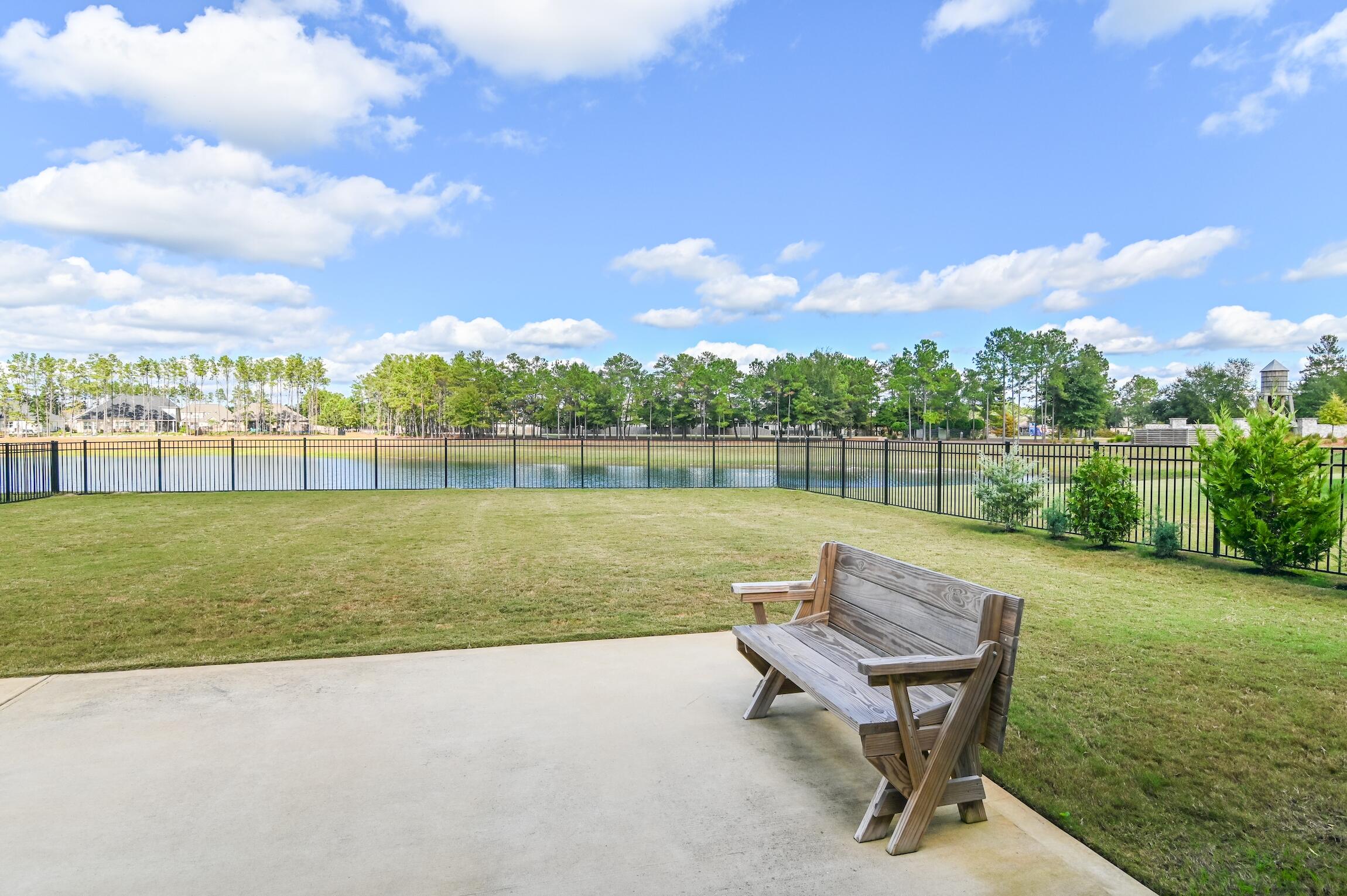 102 Mill Pond Cove Freeport, FL 32439 - Photo 31 of 46 a view of a lake with table and chairs
