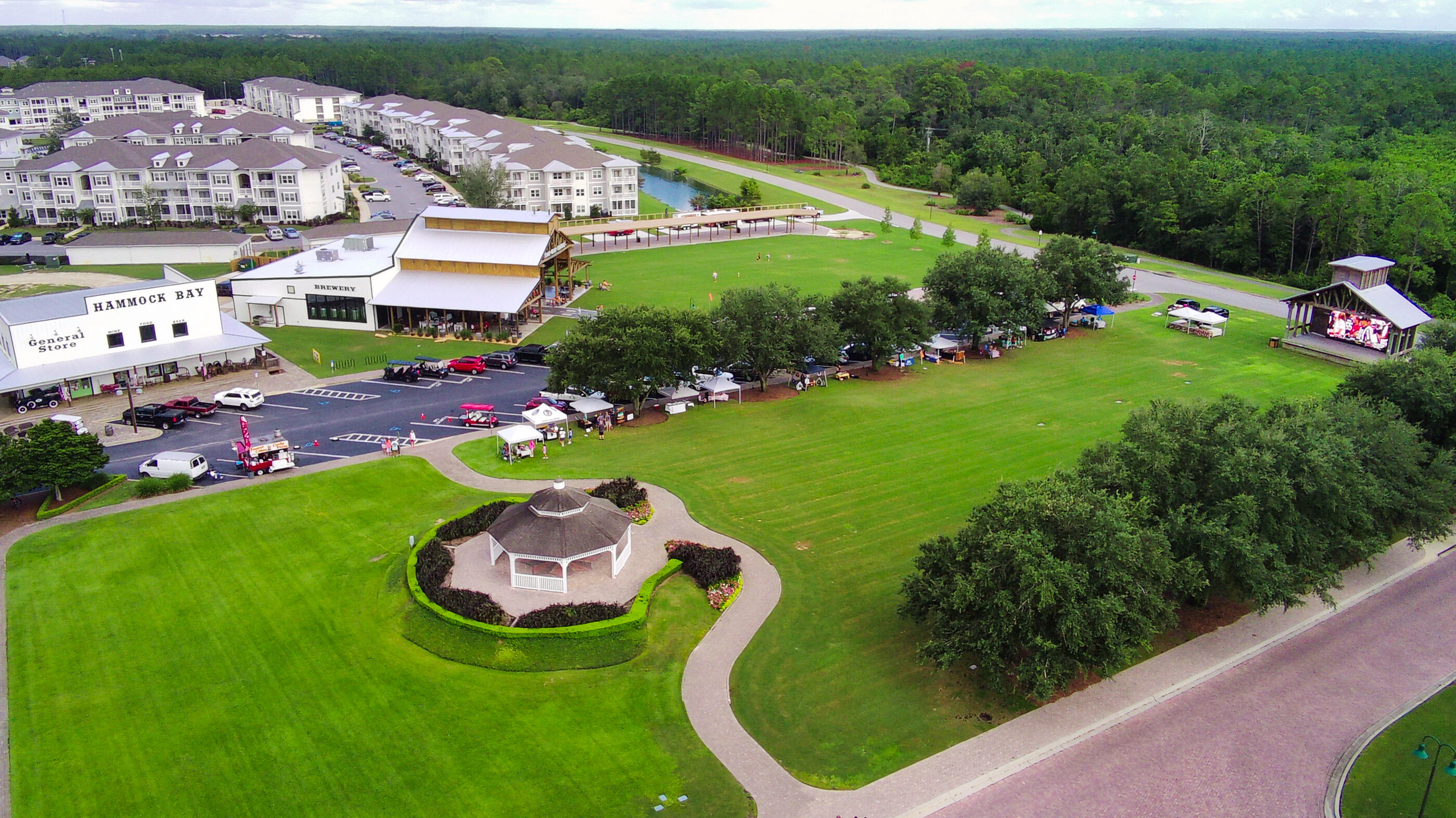 102 Mill Pond Cove Freeport, FL 32439 - Photo 37 of 46 a aerial view of a house with a garden and lake view