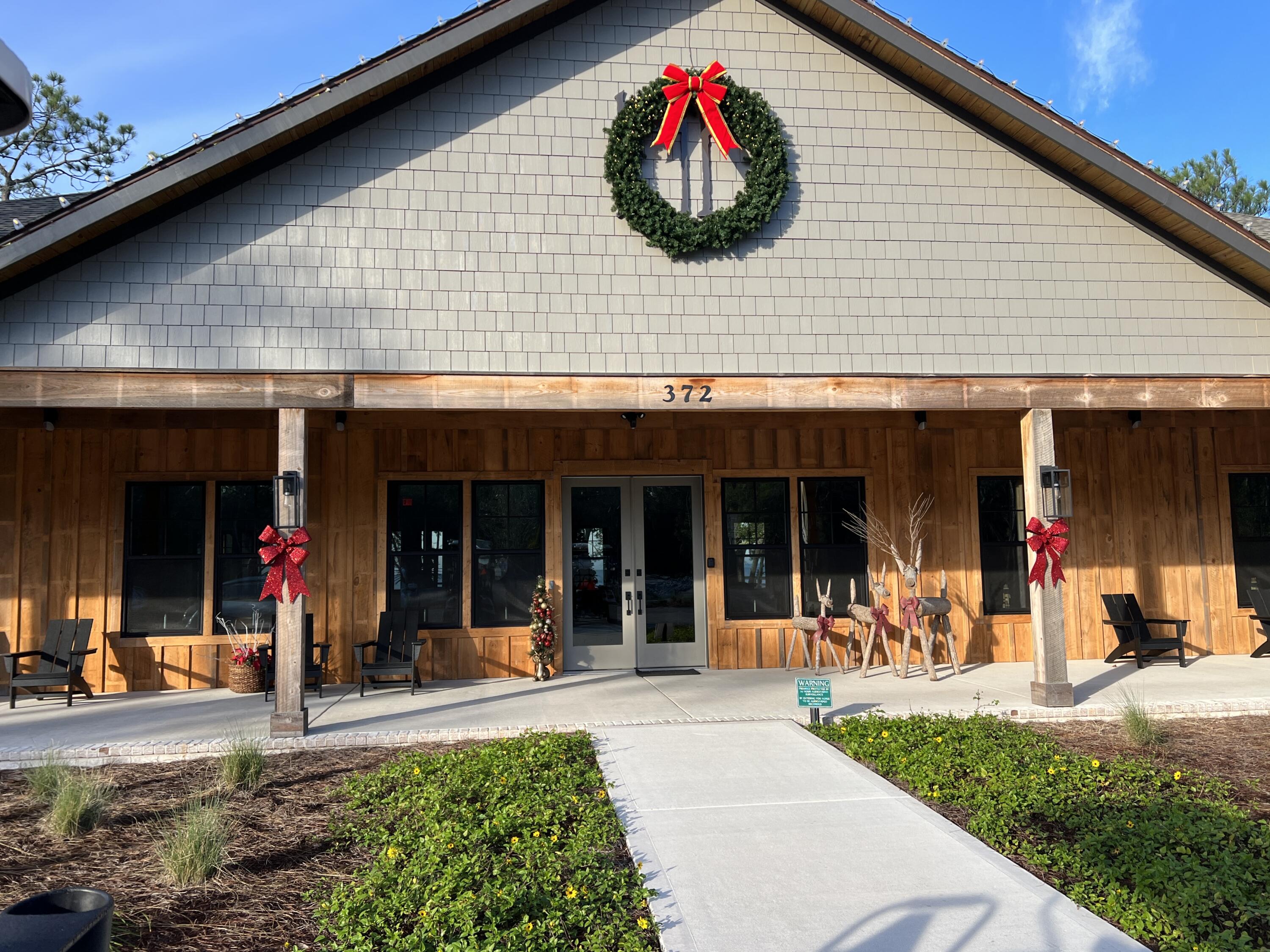 102 Mill Pond Cove Freeport, FL 32439 - Photo 44 of 46 a view of a house with a potted plant and a large window