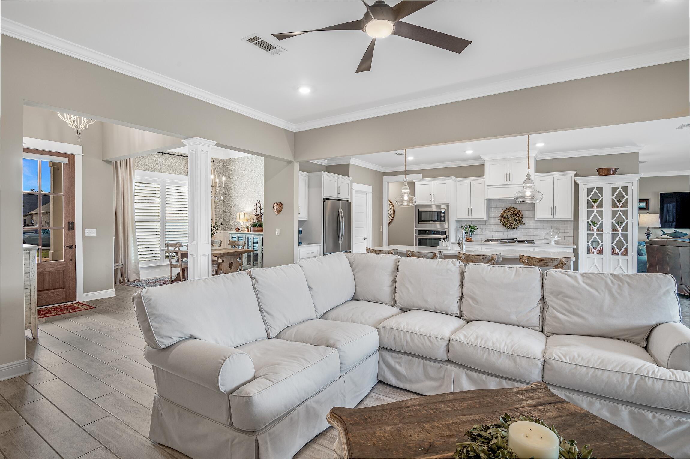 102 Mill Pond Cove Freeport, FL 32439 - Photo 7 of 46 a view of a livingroom with furniture and a view of kitchen