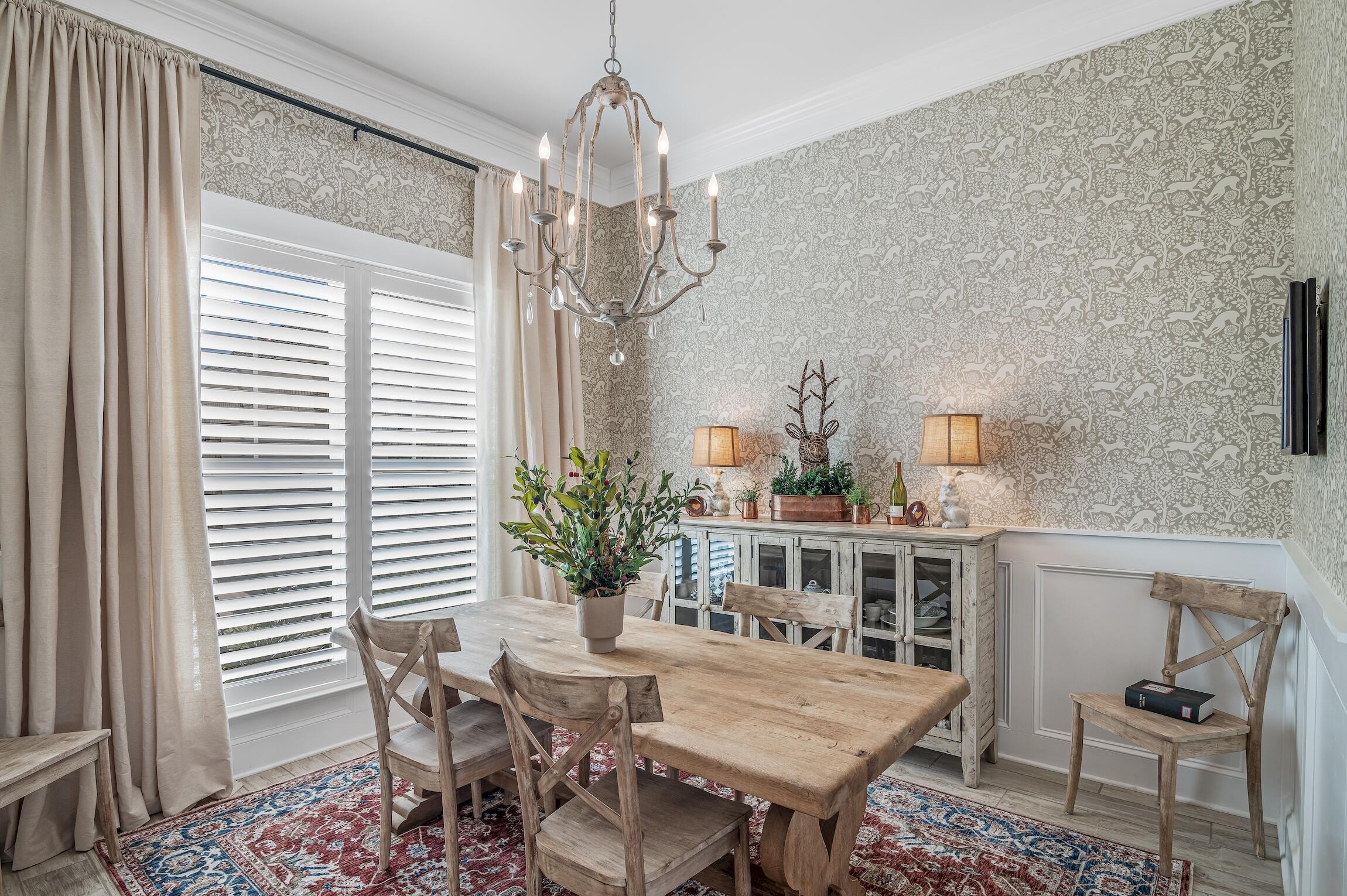 102 Mill Pond Cove Freeport, FL 32439 - Photo 10 of 46 a view of a dining room with furniture and chandelier