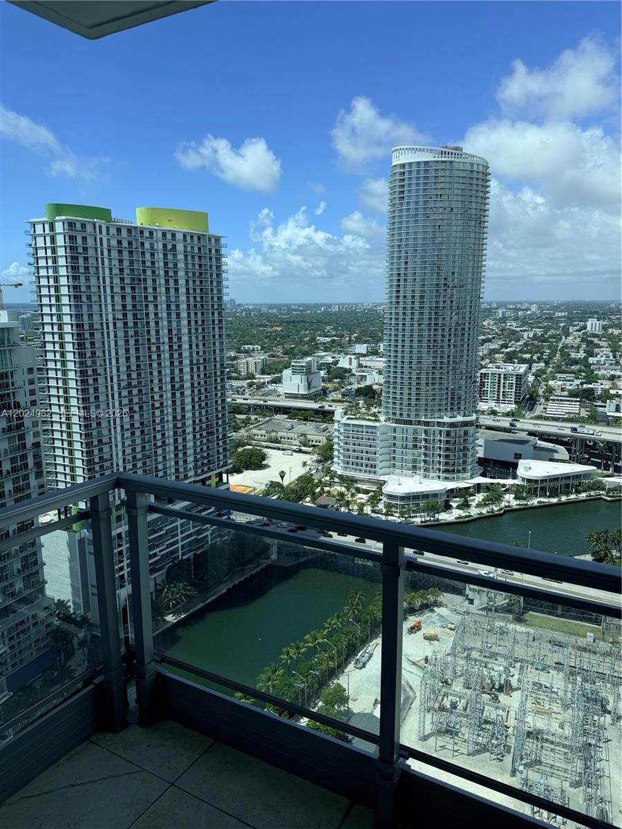 92 Southwest 3rd Street, Unit 3909 Miami, FL 33130 - Photo 9 of 13 a view of swimming pool from a balcony