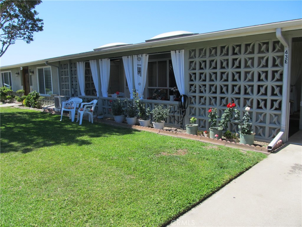 1670 Interlachen Road Seal Beach, CA 90740 - Photo 1 of 1 a front view of a house with garden