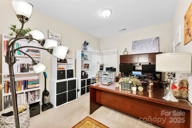 a room with furniture a rug and a window