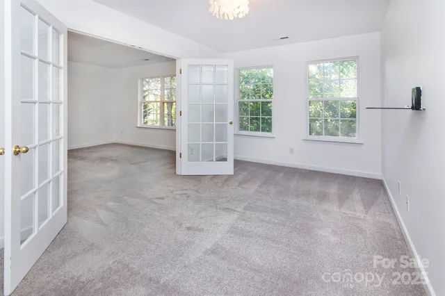 an empty room with windows