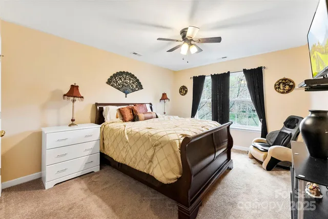 a bed room with a bed and a window