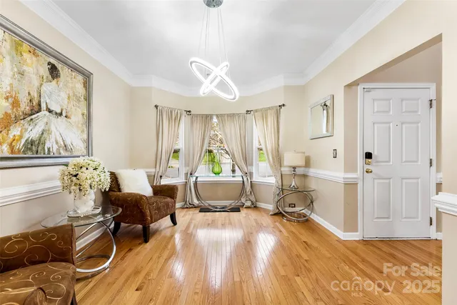 a living room with furniture fireplace and a window