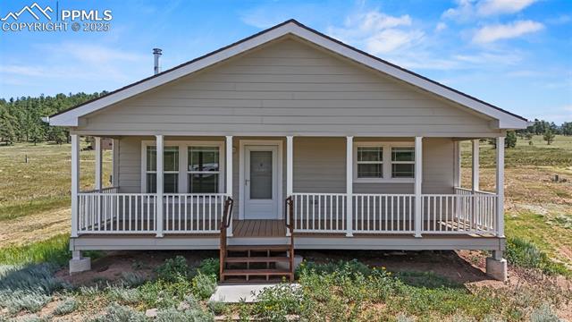 567 High Pasture Road Florissant, CO 80816 - Photo 34 of 48 View of front of house featuring a covered porch