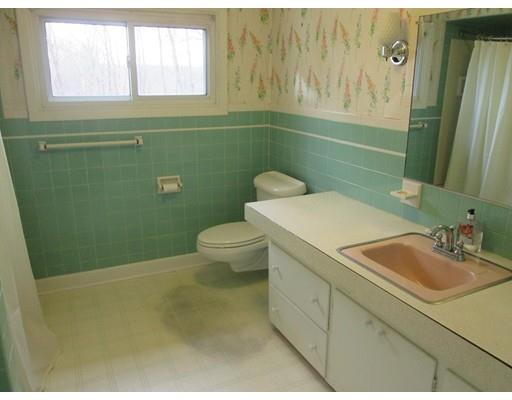 23 Tanner Road Webster, MA 01570 - Photo 23 of 30 a bathroom with a sink a toilet and a mirror