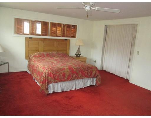 23 Tanner Road Webster, MA 01570 - Photo 24 of 30 a bedroom with a bed and closet