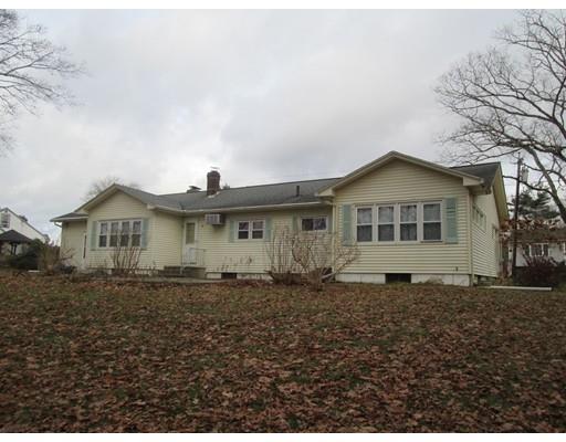 23 Tanner Road Webster, MA 01570 - Photo 3 of 30 a front view of a house with a yard