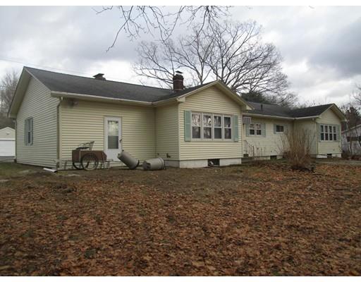 23 Tanner Road Webster, MA 01570 - Photo 4 of 30 a front view of a house with a yard