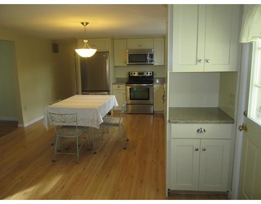 23 Tanner Road Webster, MA 01570 - Photo 7 of 30 a kitchen with a table and chairs in it