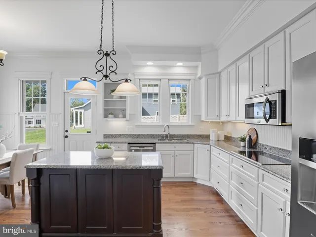 a living room with furniture potted plant and a fireplace