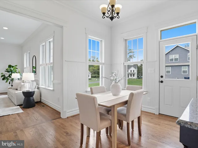 a bedroom with furniture and a large window