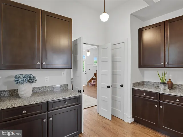 a spacious bedroom with a bed and a couch