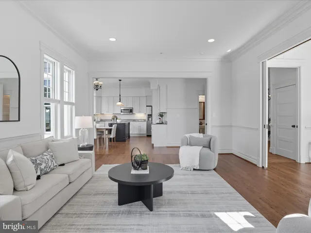 a spacious bedroom with a bed and lamp