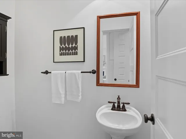 an empty room with windows and ceiling fan