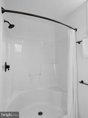 a view of storage and utility room with washer and dryer