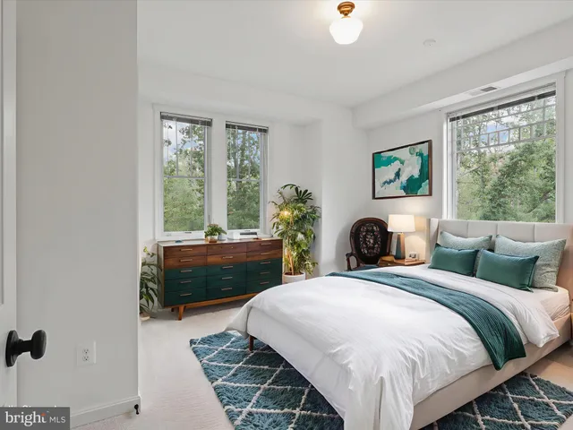 a view of a kitchen with a refrigerator cabinets and a window