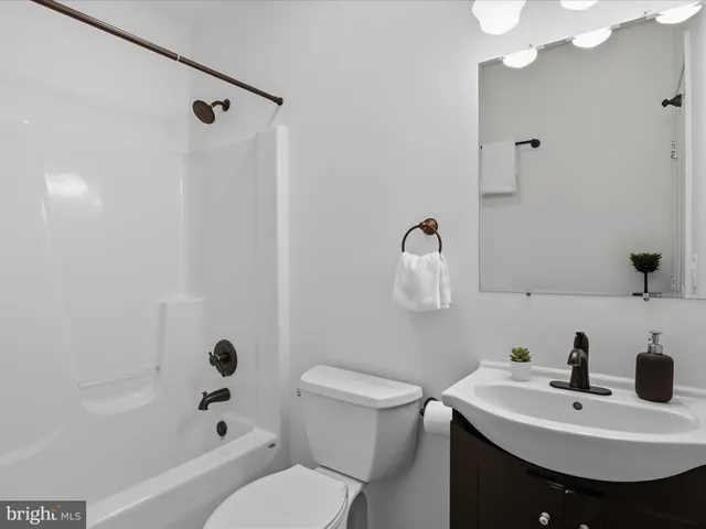 a view of a house with a yard porch and sitting area