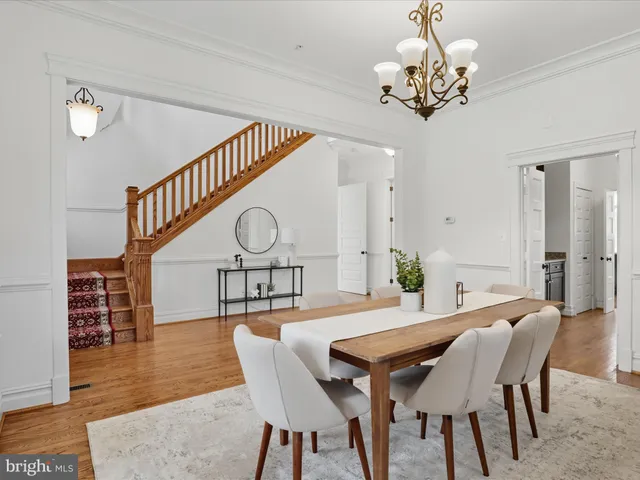 a kitchen with stainless steel appliances granite countertop a sink refrigerator and microwave