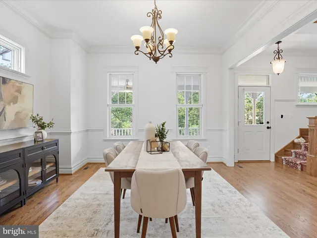 a kitchen with a table chairs and microwave