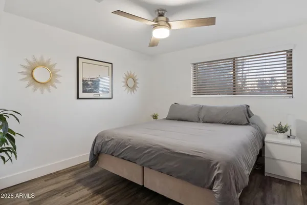 a bedroom with a bed and window
