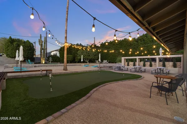 a view of a swimming pool with a patio