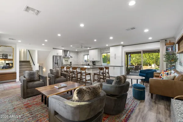 a living room with furniture and a large window