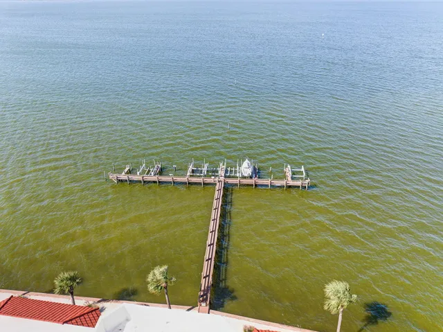 a view of a room with furniture and wooden floor