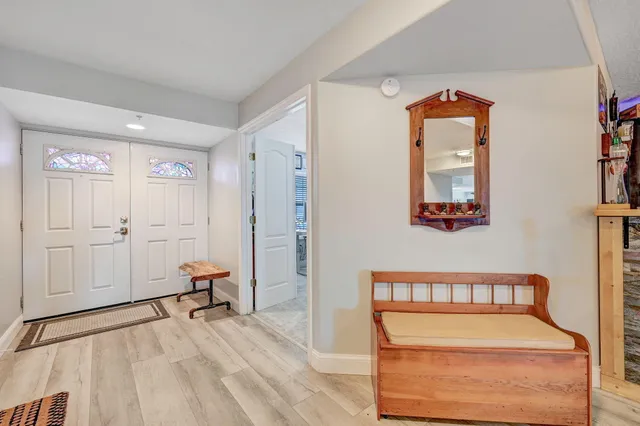 a kitchen with stainless steel appliances white cabinets and a refrigerator