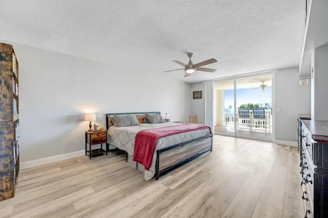 a view of a patio with a table and chairs