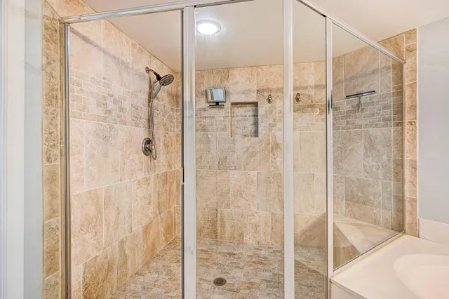 a living room with furniture and a kitchen