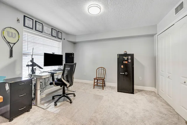 a flower garden is sitting in front of house